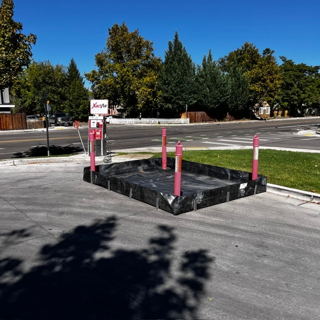 Secondary containment installed at a fuel dispensing area